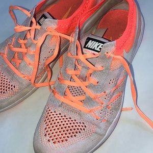 Orange Nike flyknit Training shoes